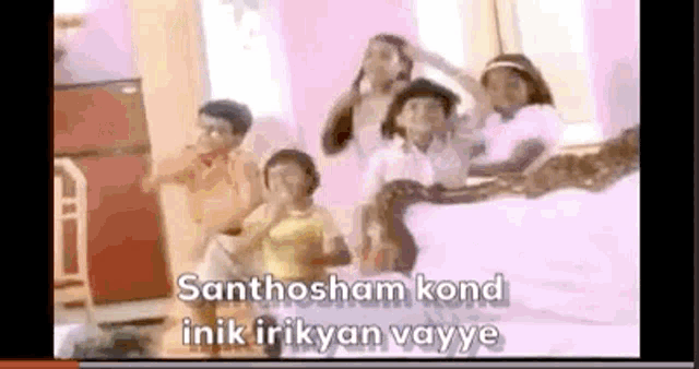 a group of children are standing next to each other in a room and dancing .