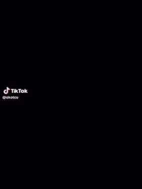 a man is standing next to a little girl wearing a mask with tiktok written on the bottom