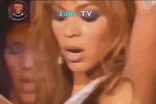 a close up of a woman 's face with the words zabz tv written on it