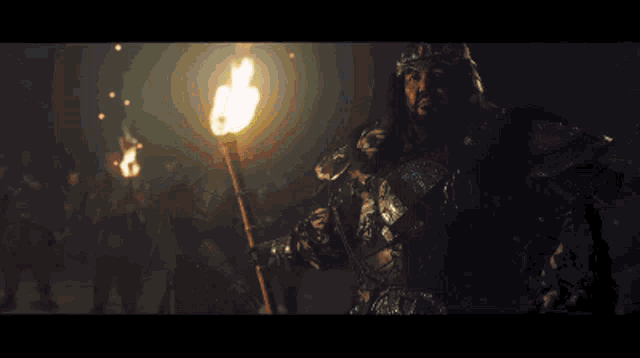 a pixel art of a man in armor with a torch