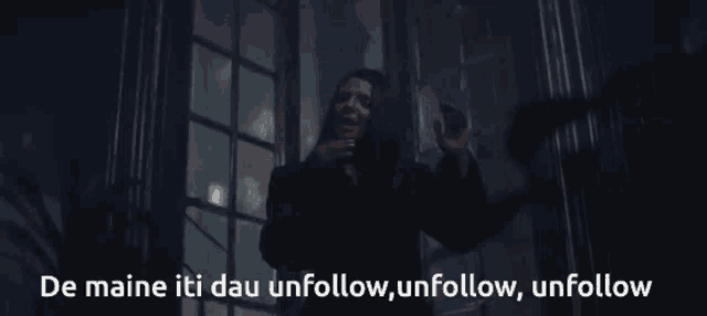 a woman stands in a dark room with the words de maine iti dau unfollow unfollow unfollow