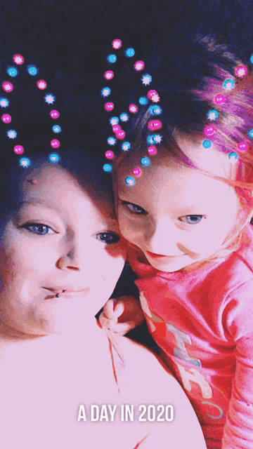 a woman and a little girl are posing for a picture with the words a day in 2020 below them