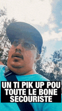 a man wearing glasses and a hat with the words " un ti pik up pou toute le bone secouriste "