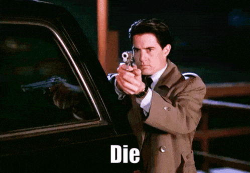 a man in a trench coat is holding a gun and the word die is on the bottom of the image