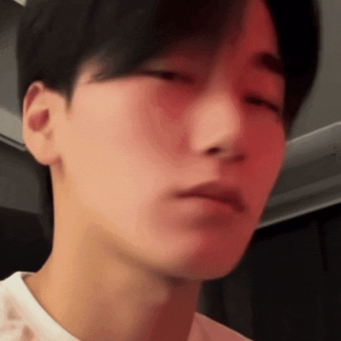 a close up of a person 's face with their eyes closed