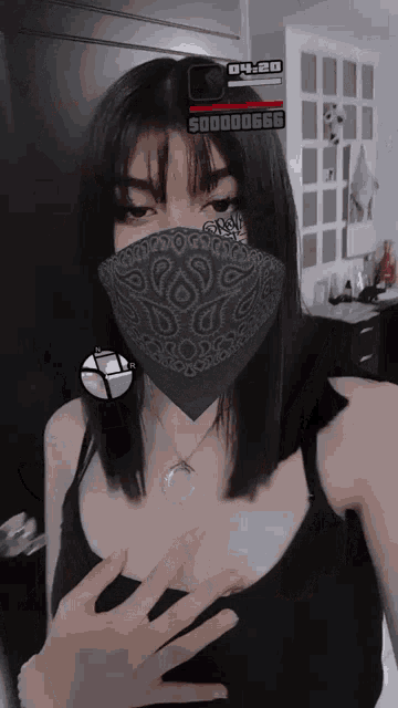 a woman wearing a bandana and a necklace has a sticker on her face that says 04:28