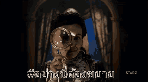 a woman holding a magnifying glass in front of her eye with a starz logo in the background