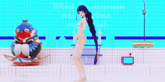 a girl in a bikini is standing next to a penguin float