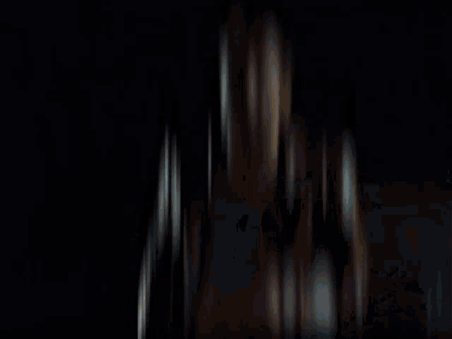 a blurry picture of a person behind a curtain