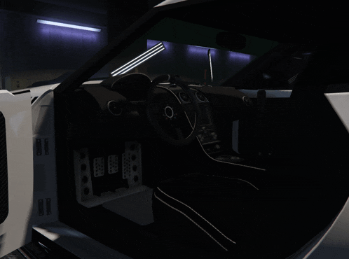 the interior of a car with the door open and the steering wheel visible