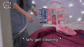 a woman standing next to a bed with the words lets get cleaning on the bottom