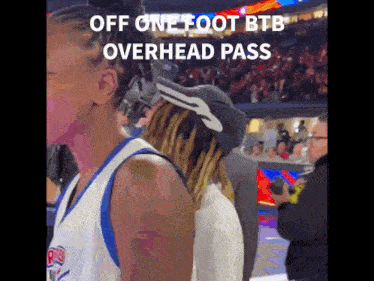 a basketball player wearing a hat with the words off one foot btb overhead pass below it