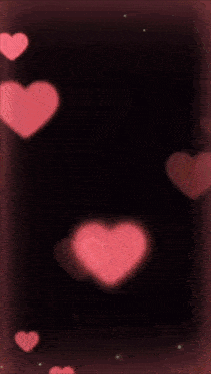 a picture of a man and a woman surrounded by hearts with the letter s on the bottom