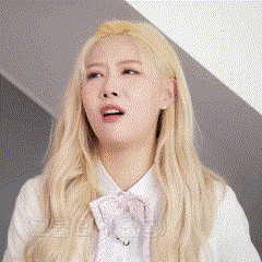 a close up of a woman with blonde hair wearing a white shirt and bow tie .