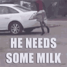 a white car with the words he needs some milk on the bottom
