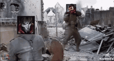 two soldiers are standing in front of a destroyed building and one of them has a picture of a soldier on his head .
