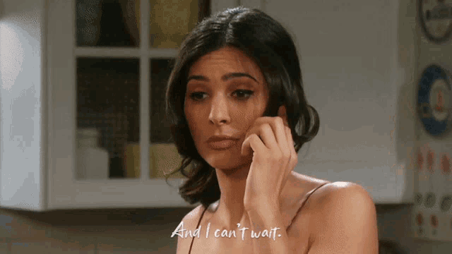 a woman in a kitchen with the words " and i can 't wait " written on the bottom
