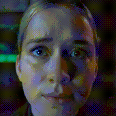 a close up of a woman 's face with a grid pattern on it .