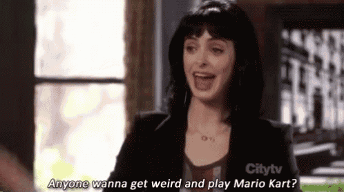 a woman is laughing while talking about mario kart .