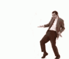 mr bean is dancing with his arms outstretched on a white background .