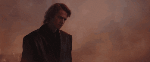 a man is holding a red laser beam in his hand