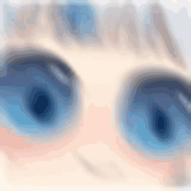 a close up of a person 's blue eyes with a blurred background .