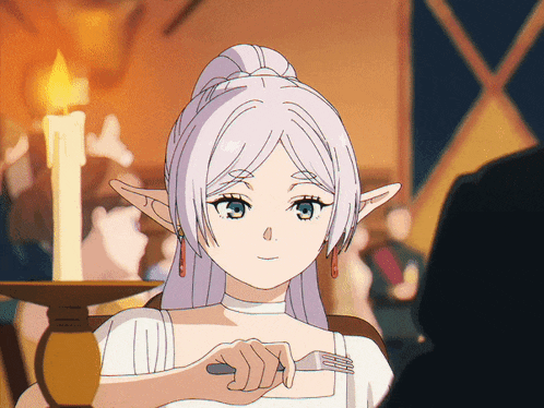a woman with white hair is holding a fork in her hand