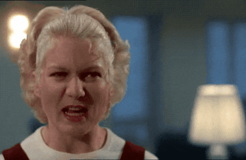 a woman with blonde hair is making a funny face