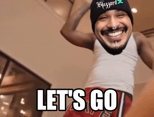 a man wearing a beanie and a tank top with the words let 's go on it