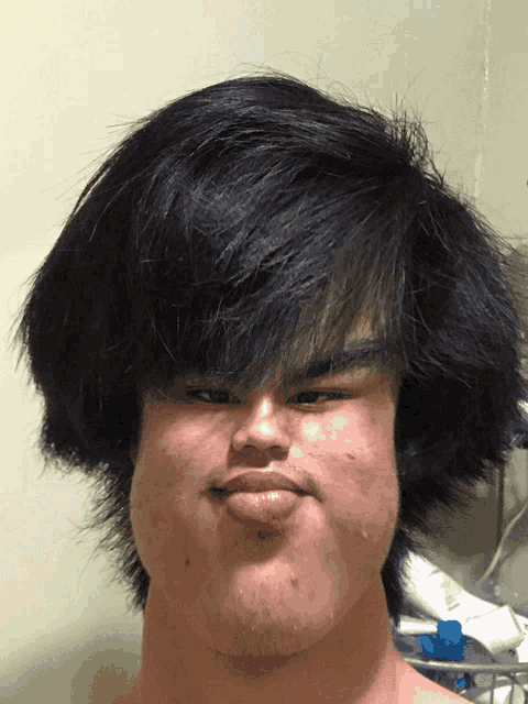 a man with a beard has a very large head