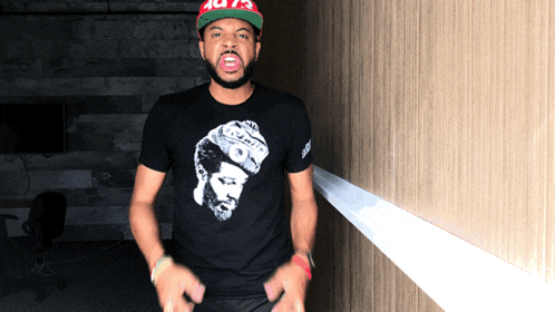 a man wearing a supreme hat and a t-shirt