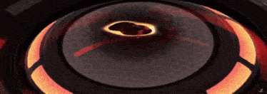 a close up of a circular object with a black hole in the center