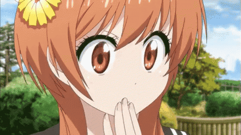 a girl with orange hair has a flower in her hair