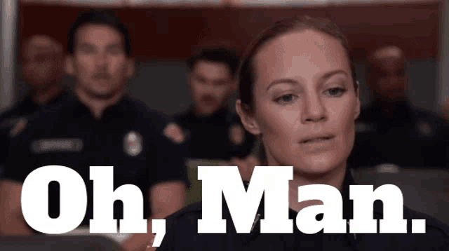 a woman is standing in front of a group of police officers and says oh man