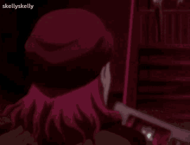 a girl with pink hair is holding a gun in a dark room with a red background .