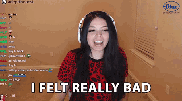 a woman wearing headphones and a red shirt says i felt really bad