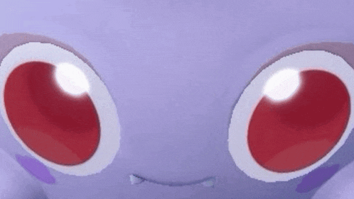 a close up of a purple monster with red eyes and a white nose .
