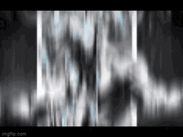a blurry picture of a waterfall in the dark