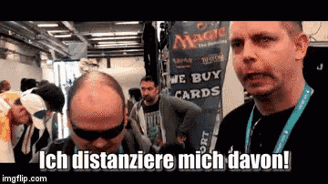 two men are standing in front of a sign that says magic