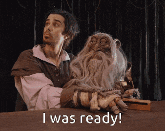 a man is holding a puppet with the words i was ready below him