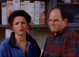 a man and a woman are standing next to each other in a kitchen