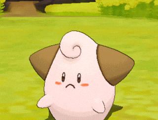 a cartoon character with a sad face is standing in a field
