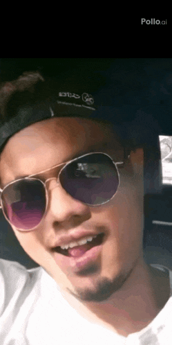a man wearing sunglasses and a hat that says pollo.al on it