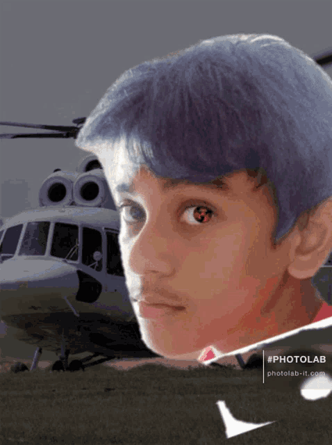 a boy with blue hair is standing in front of a helicopter with a photolab watermark