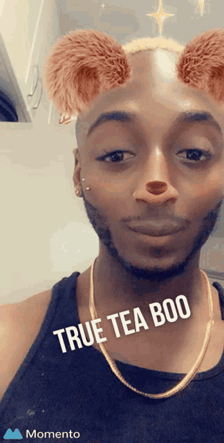 a man is wearing a filter that says true tea boo on it