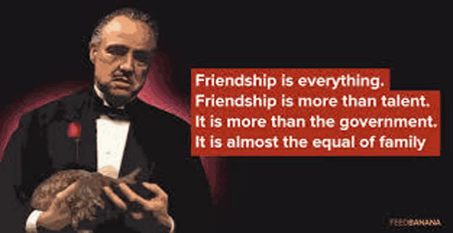 a man in a tuxedo is holding a rabbit and a quote from the godfather .