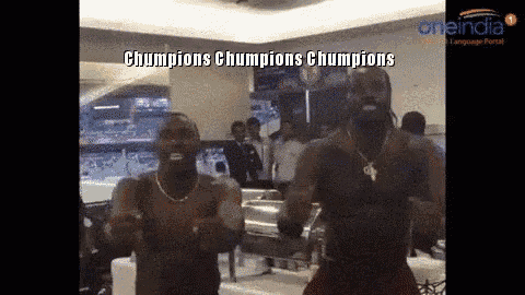 two men are dancing in a room with the words champions champions champions written on the bottom