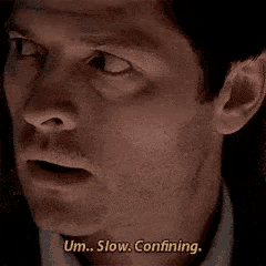 a close up of a man 's face with the words um slow confining on the bottom
