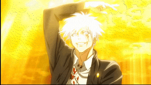 a man in a suit and tie is smiling with his arm up in the air