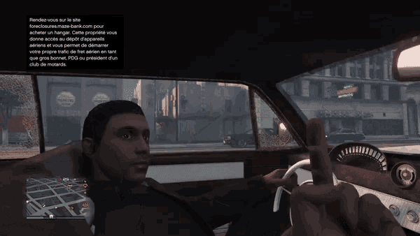 a man is driving a car in a video game while holding a car key